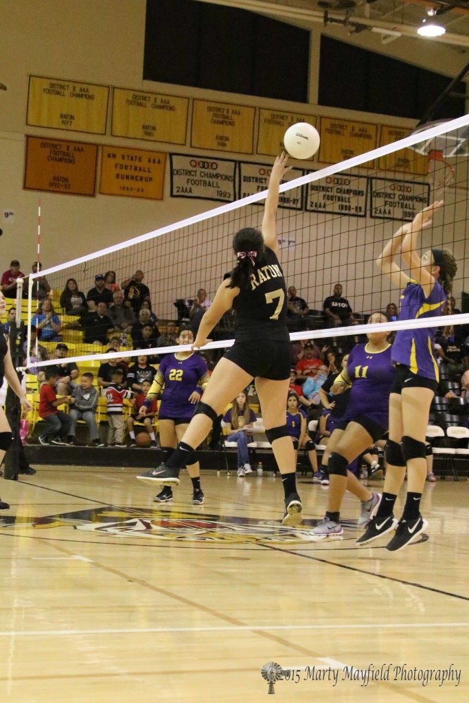 Marklyn Pacheco tips the ball over the net in the JV game with Tucumcari Saturday evening