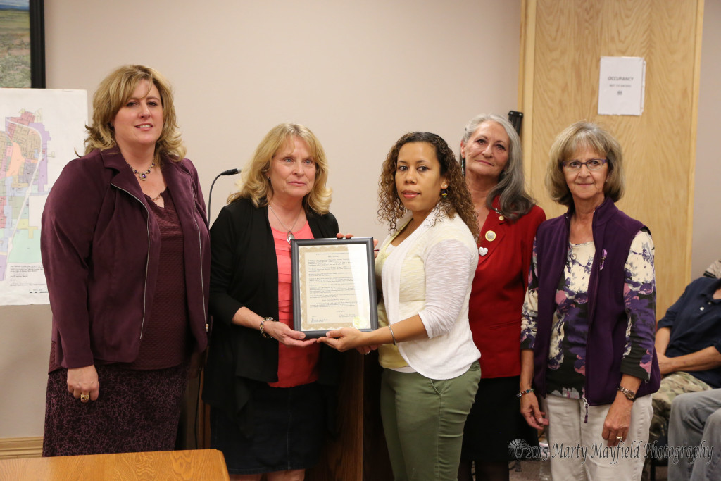 Michael Anne Antonucci, Collette Armijo, Paula Cacciatore and Mercy Swanson accept the proclamation for National Professional Business Women's Week from Commissioner Lindé Schuster.