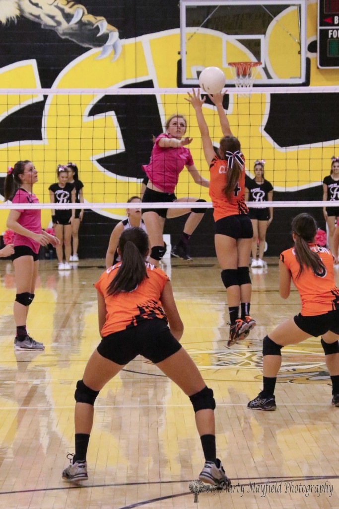 Alina Pillmore makes the hit count as it goes past Sierra Skaggs Saturday afternoon in Tiger Gym
