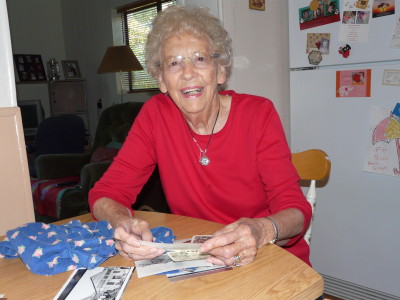 Emagene Saracino shares some reminders of the past, including her mother's sun bonnet. Her mother, Mary Buttram, wore the bonnet while gardening in Dawson.