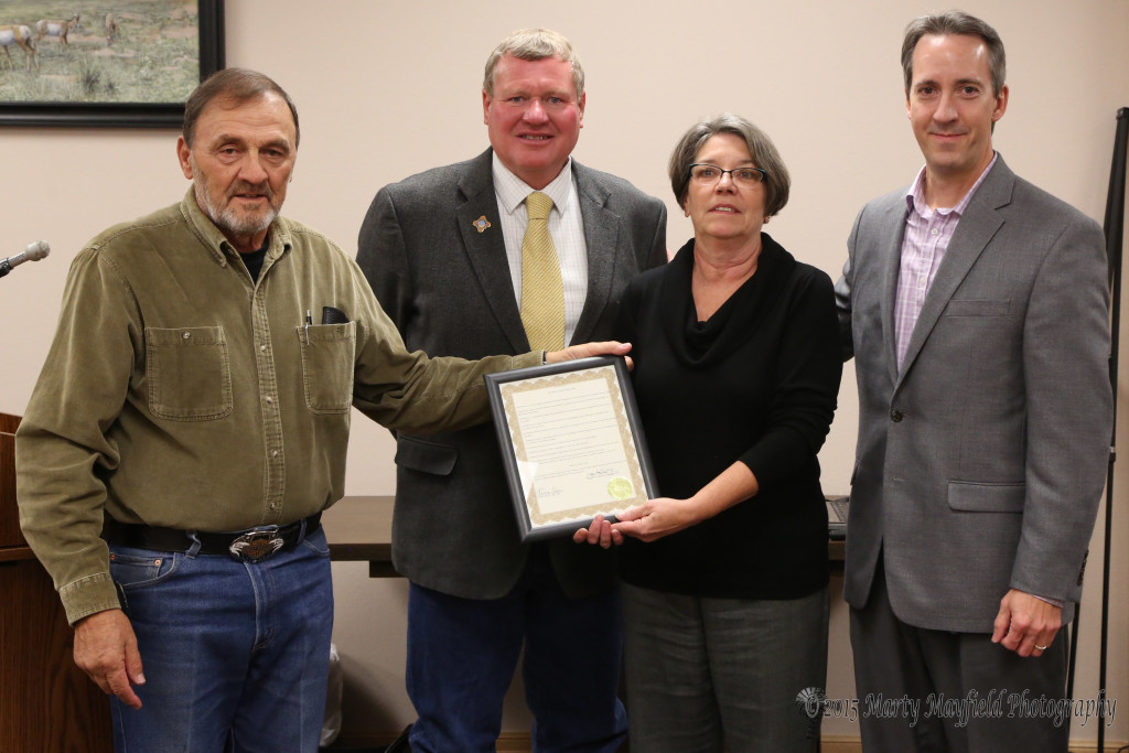 Commissioner Don Giacomo presents the Miner's Day proclamation to Scott Berry, Kathy McQuery and Shawn Lerch 