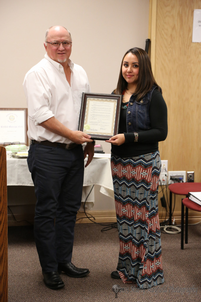 Tricia Garcia receives the proclamation acknowledging her new certification 