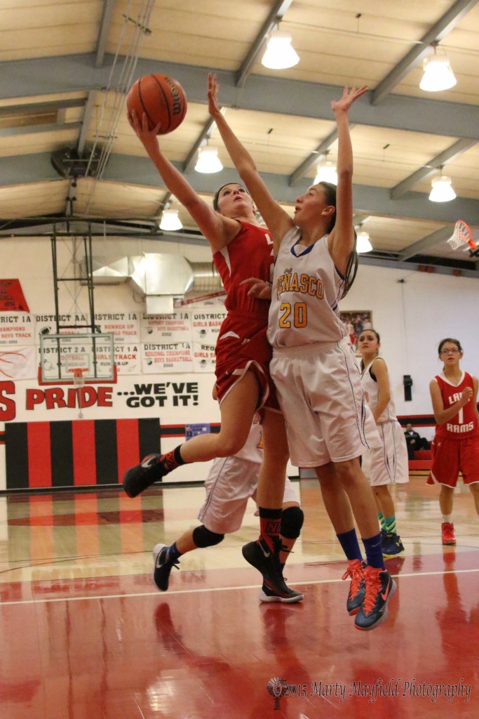 Gentry Haukebo goes up for the shot as Carly Gonzales attempts the block during the 2015 Cowbell Tourney