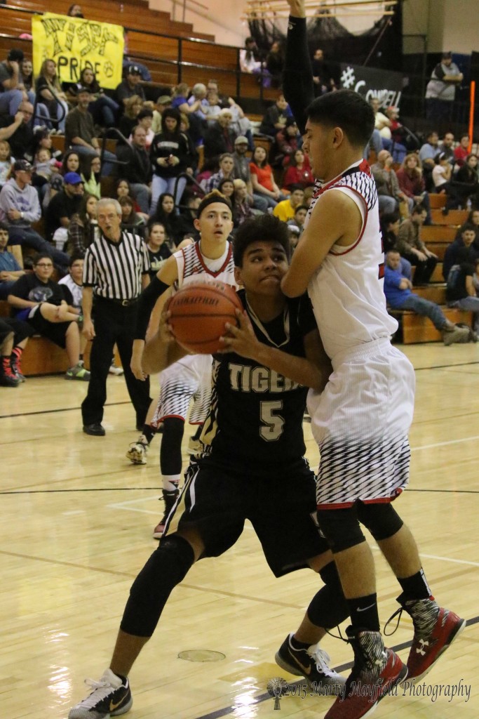 Zac Caldwell gets an arm on Austin Jones tries to head up for the basket in the 2015 Cowbell