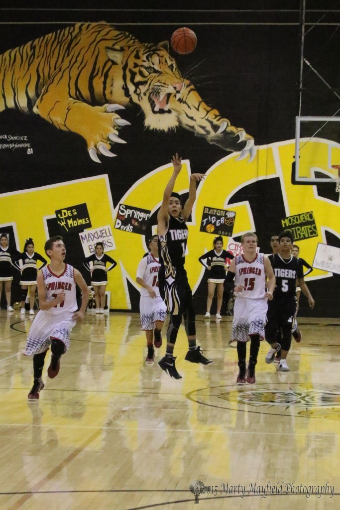 Jesse Espinoza launches a 3-point shot at the first half buzzer and sinks it during the 2015 Cowbell