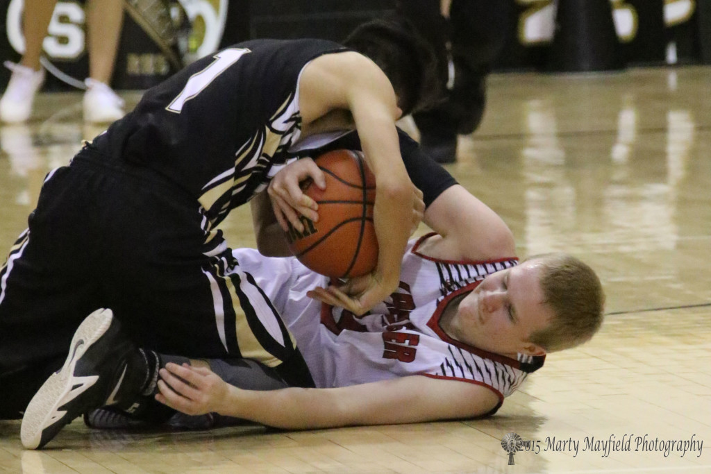 Damien Blauback and Jesse Espinoza scramble for control of the ball. It was finally ruled a tie ball during the 2015 Cowbell in Raton.