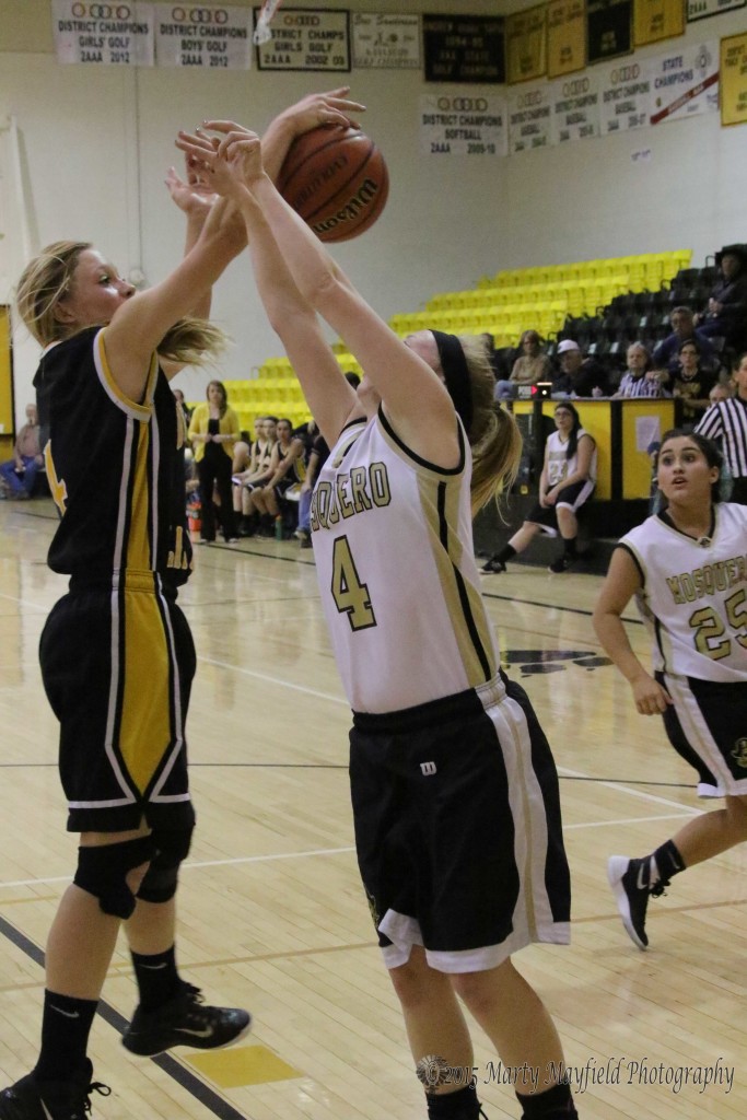 Four on Four MaKenna Hittson (4) gets a hand on the ball as Sherrie Ray (4) goes up for the shot Saturday morning.