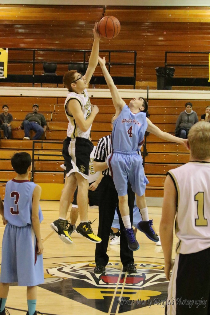 Outsized in height but not scrappiness the Wagon Mound Trojans take on the Mosquero Pirates, here Pirate Antonio Valdez easily out jumps Dylan Quimby Saturday morning 