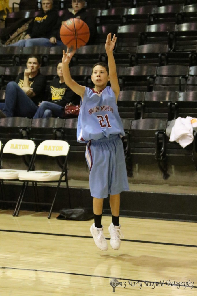 Dominic Armijo only about 4ft tall launches the ball from the right wing for the Trojans