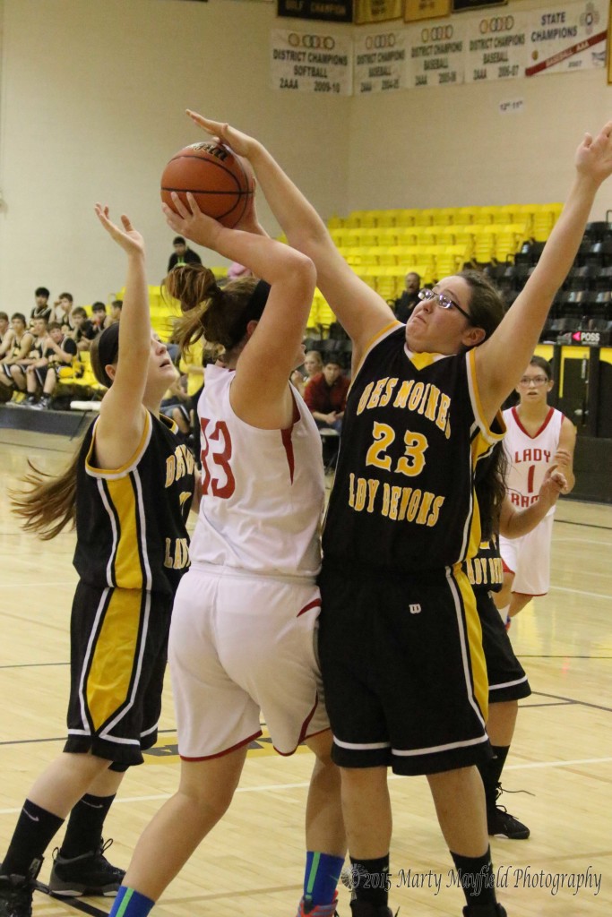 Mariah Vanderlei goes for the shot as Angie Lopez gets a hand on the ball during the consolation game at the 2015 Cowbell Tourney