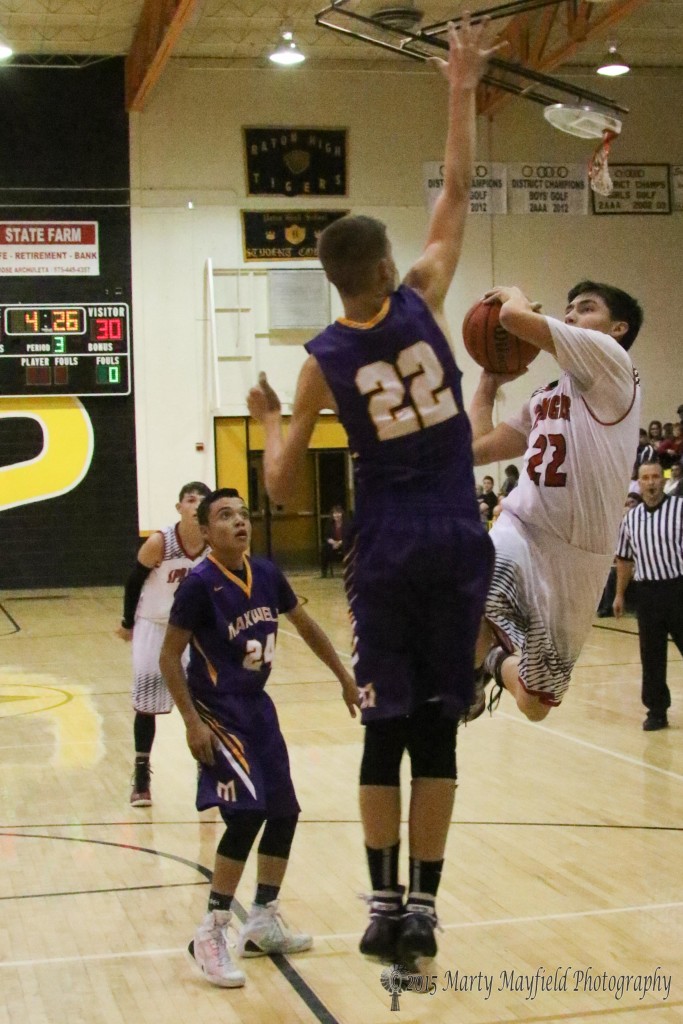 Kolten Riggs works for the block as Damien Blaubach goes for the shot Monday evening during the 2015 Cowbell