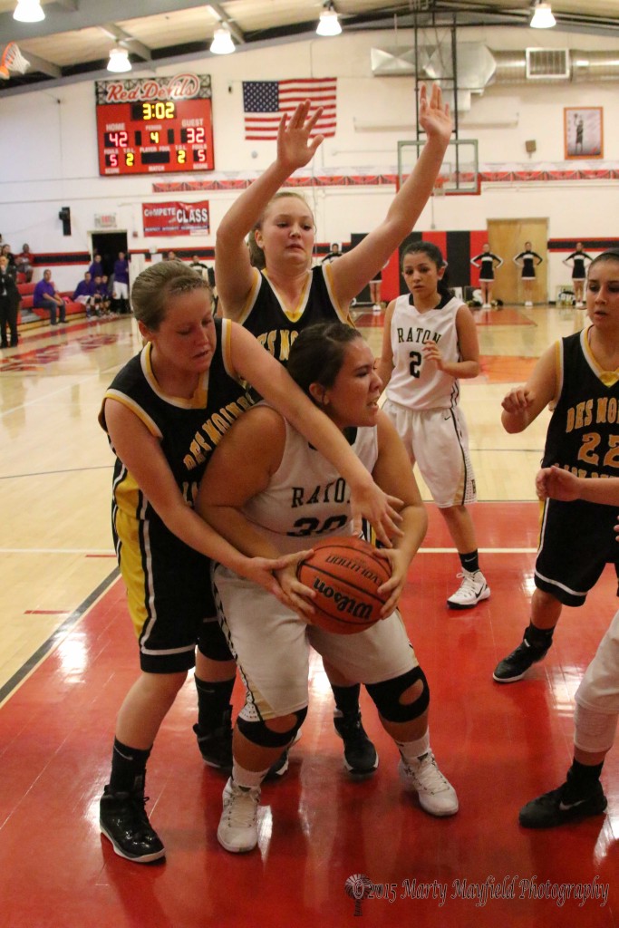 Rayelle Rivale says I want the ball as she reaches around Sydni Silva to grab the ball. 