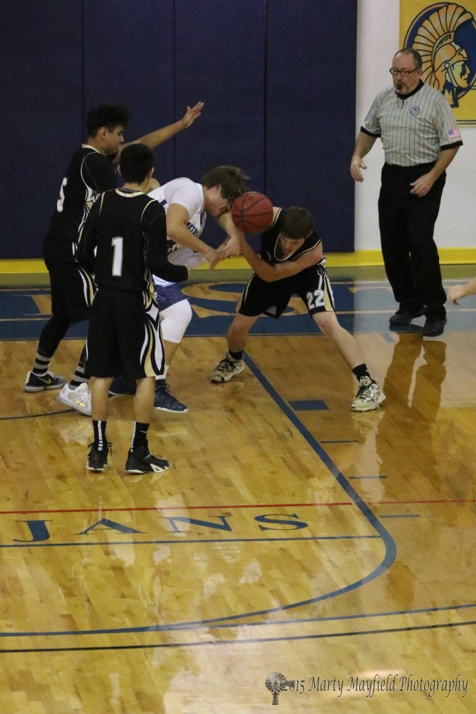 Miner Darian Lujan and Tiger Dillon Lemons go for the loose ball Friday afternoon at the TSJC Tourney