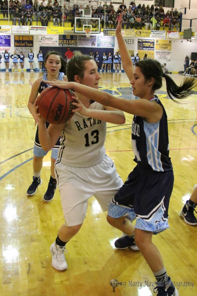 Halle Medina (13) pulls back as Jade Sanchez gets a hand on the ball and a foot on the foot during the second round of basketball at the TSJC Tourney