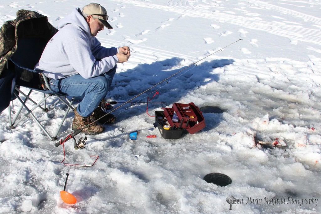 Martin prepares a lure to go below the ice 