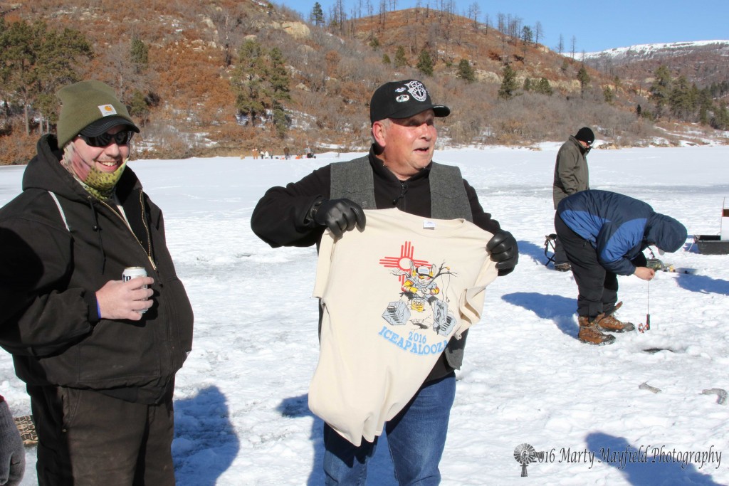 Raton city commissioner Ron Chavez shows off the t-shirt the guys had made to represent the 10th Iceapalooza 