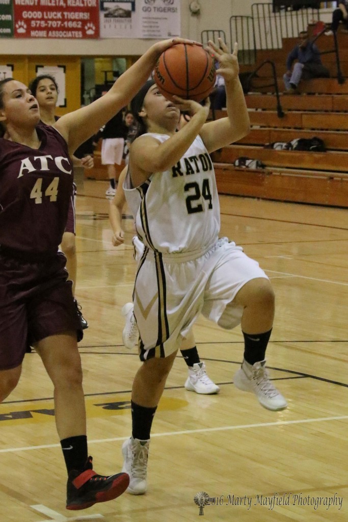 Lina Lozano get a hand on the ball as Breanna Muniz goes for the basket during the JV game Saturday afternoon
