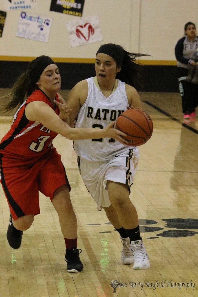 Cordova gets a hand on the ball as Becca Muniz drives into the lane for a shot during the JV game