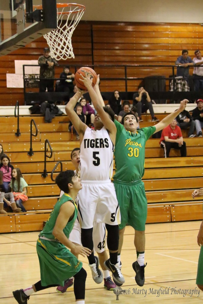 Austin Jones (5) goes in for the short shot as Joseph Vigil (30) helps him out by pushing the ball from behind