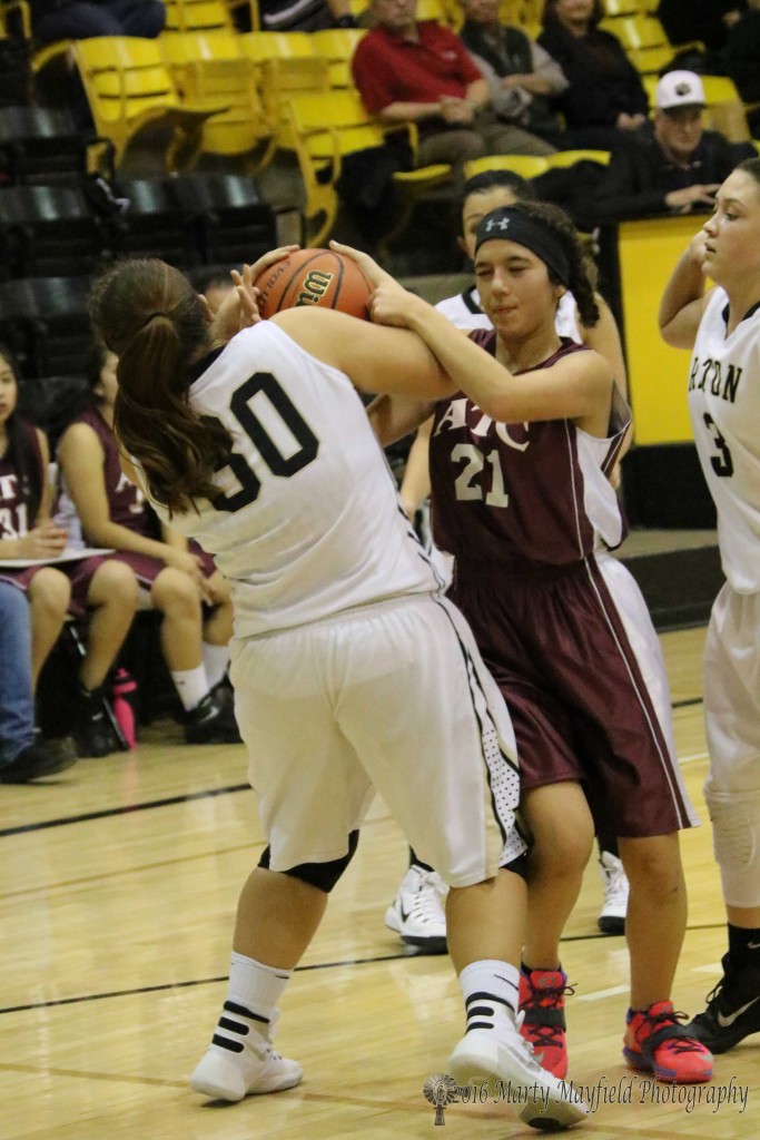 Sydni Silva (30) grabs the ball and puts it away from Valeria Cera (21) 