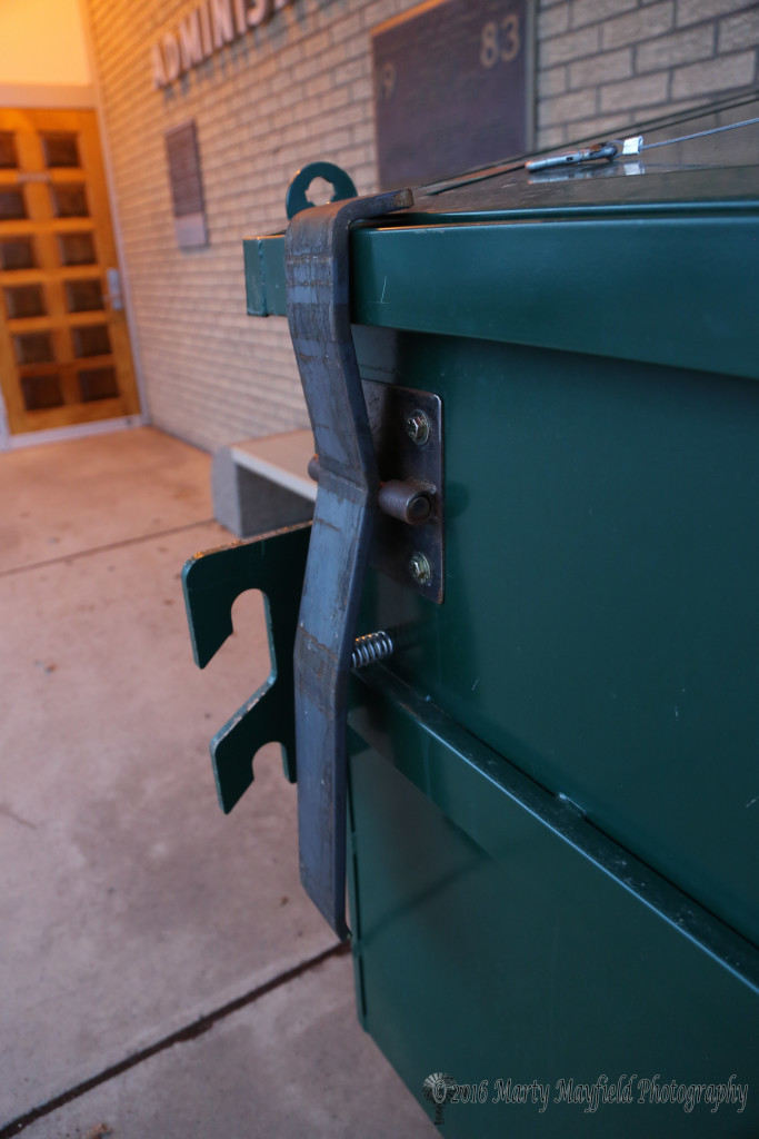This new bear proof dumpster sports a spring loaded latch that will be tripped by the tongs on the garbage truck