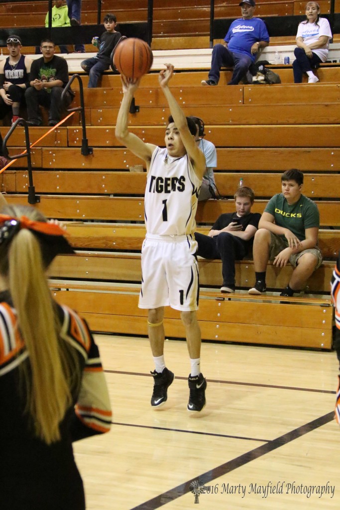 Jesse Espinoza puts it up from 3-point territory for one of his two 3-pointers in the first quarter. 