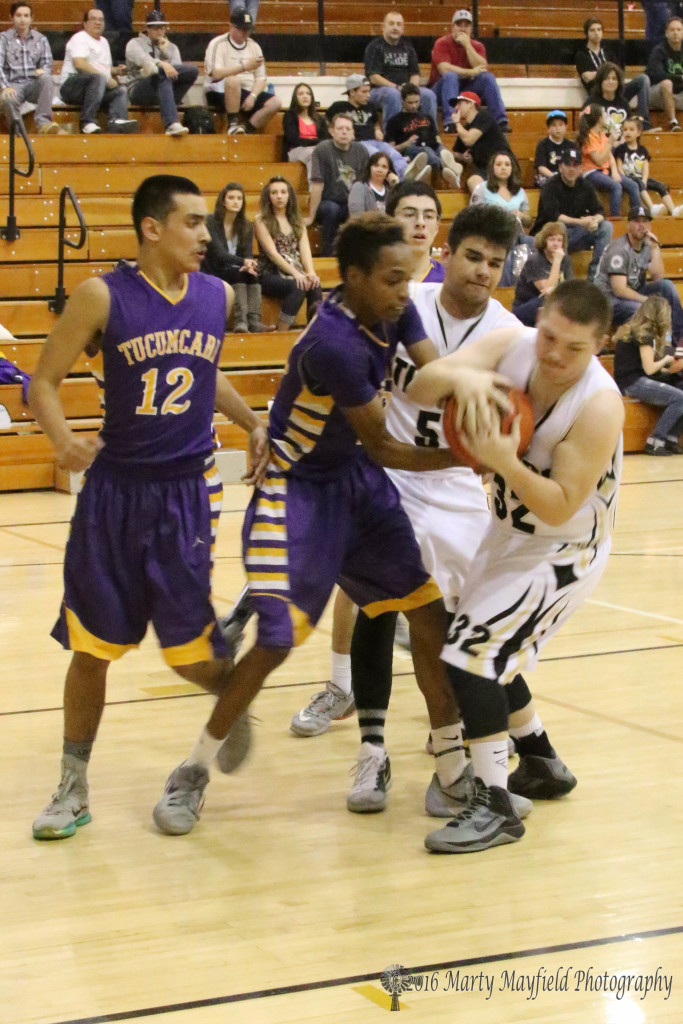 Tyler Hightower (32) and Cedric Henderson (32) struggle for the ball as Jose Duran (12) and Austin Jones look on 