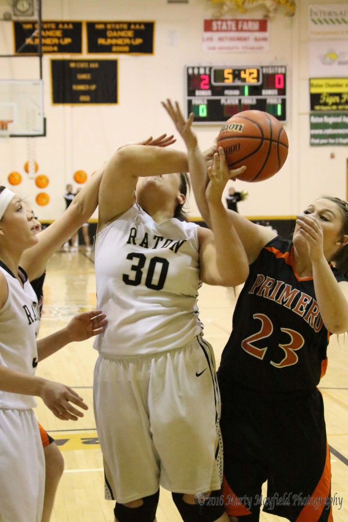 Analyse Kendall (23)  gets an hand on the ball as Jadyn Walton (30) goes up for the shot Thursday evening in Tiger Gym