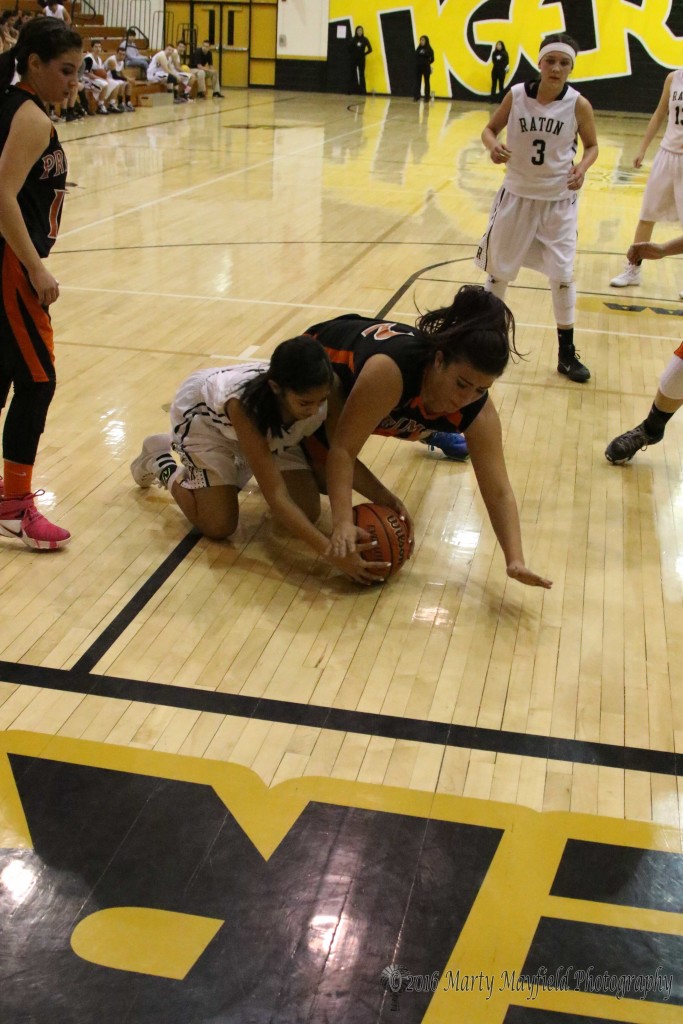 Autumn Archuleta gets her hands on the loose ball as Taylor Mestas goes to the floor after the ball.