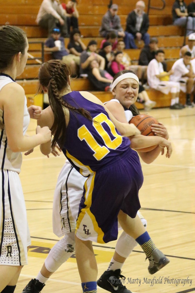 Alyssa Martinez (10) draws the foul as she gets a hand on Estrella Vargas late in the game Saturday evening 