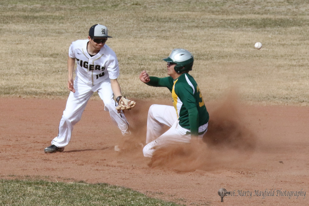 The throw flies by Damien Martinez as Antonio Bustimonte slides for second 