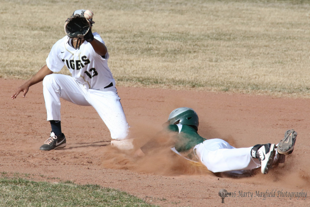 Jonathan Cabrieles reaches for the ball as Jacob Samora slides for second and a safe call. 