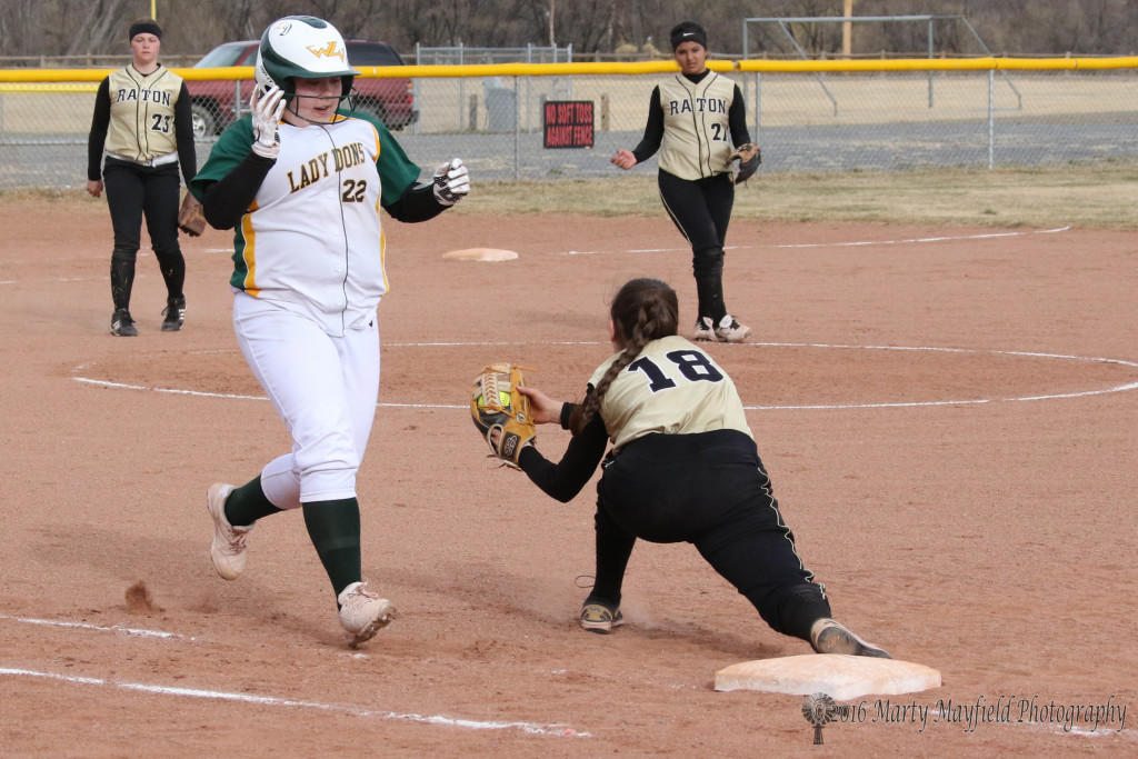 The throw to first is once again in time as Halle Medina reaches for the out.