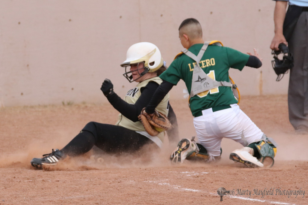 Lucero makes the tag as Jadyn Walton slides into home during game 2 of the double header with West.