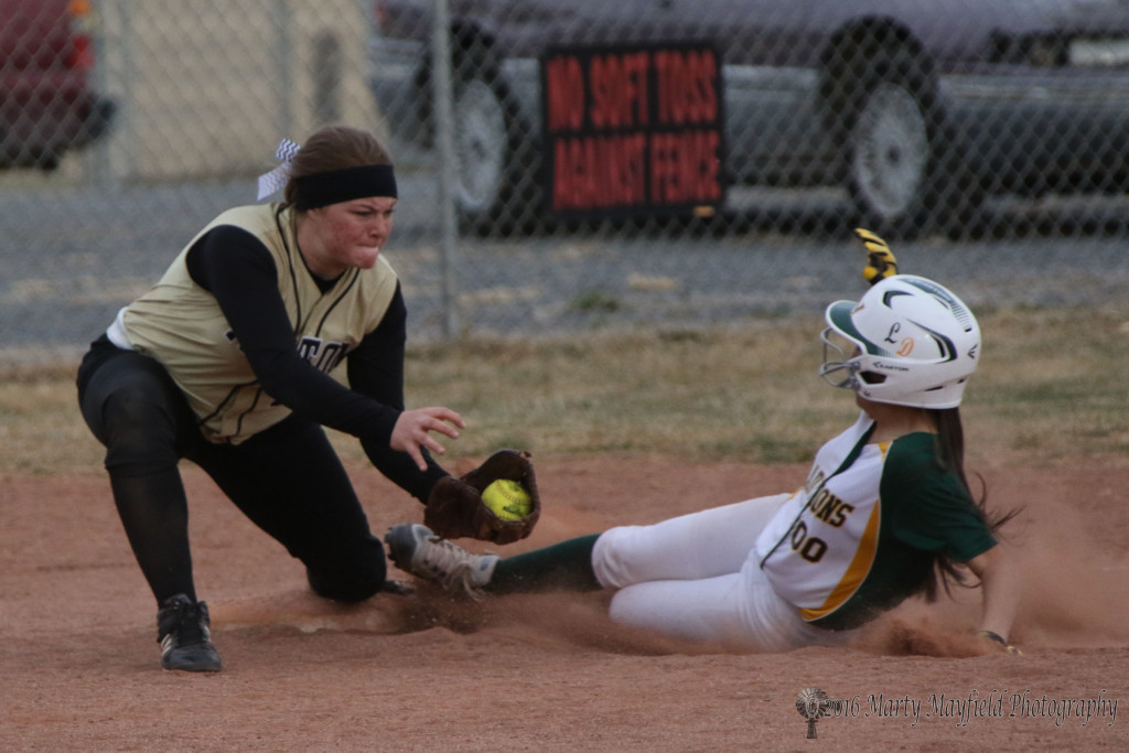 Jadyn Walton just misses the tag at third as this Lady Don slides in safe during game 2 Monday afternoon
