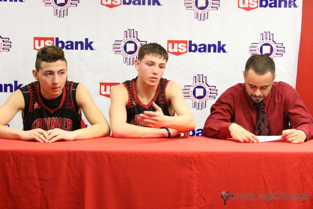 Estevan Romero, Isaiah Garcia and Coach Jimmy Apodaca speak to reporters after the game Saturday. 