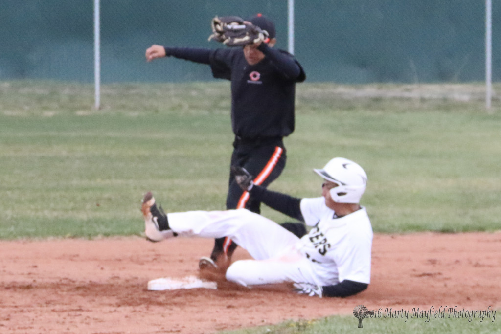 Richie Gonzales slides into second and avoids the tag. 