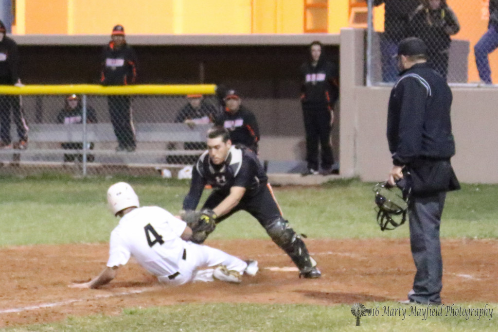 Ethan gets caught in the pickle and is tagged out as he slides into home late in game two of the Clayton double header