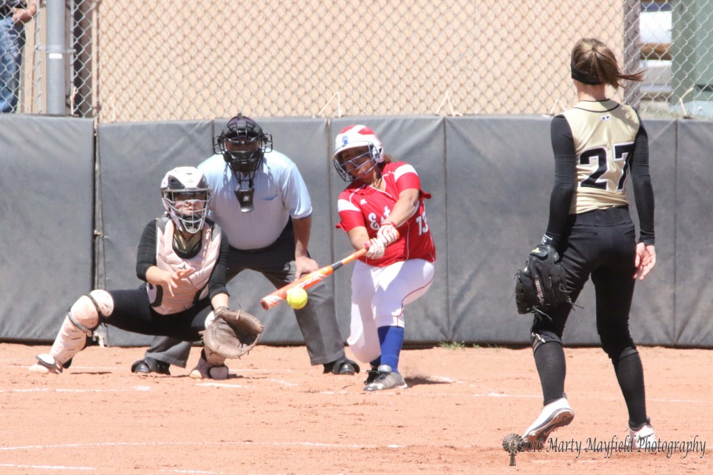 Kendra Warrior gets a piece of the ball but it goes foul inside the batter's box