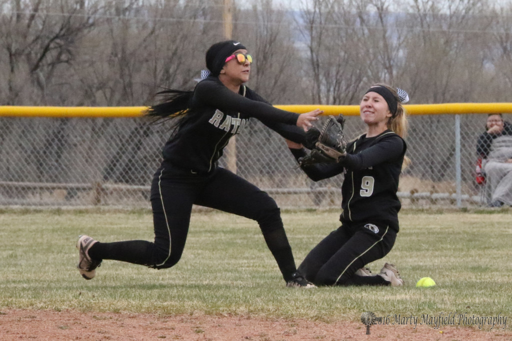 Natausha Ortega and Mariah Encinias make the play for the fly ball early in game one of a double header with Laguna Acoma