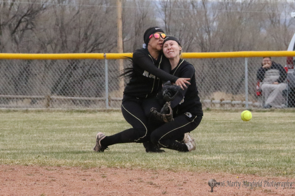 Natausha Ortega and Mariah Encinias collide as both made a play for the fly ball in center field. 