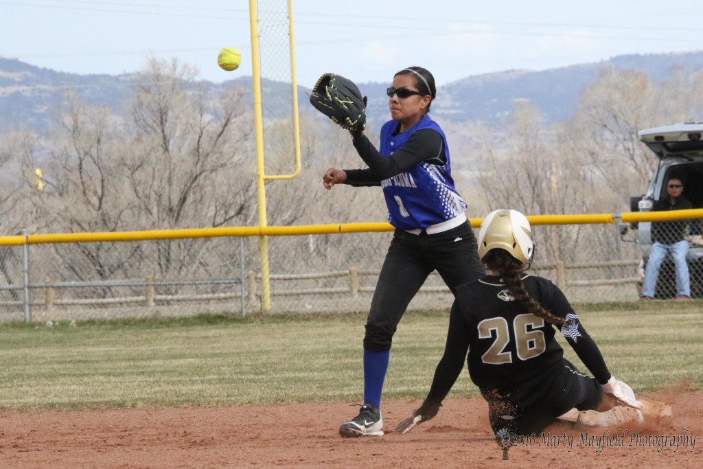Camryn Stroeker makes it safe at second as the ball arrives a bit late on the throw from the catcher.