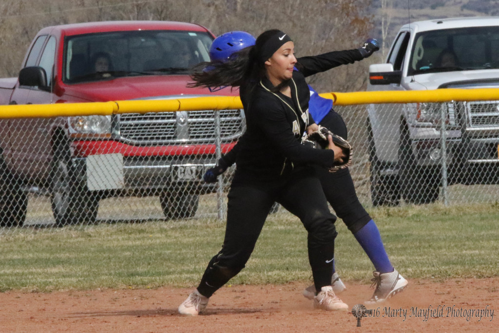 Sophia Madellini just misses the tag but makes the turn and the throw to third for the out. 
