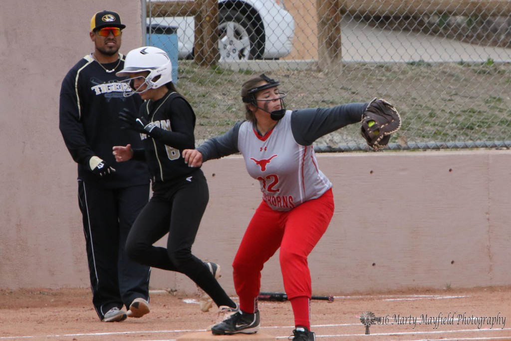 Estrella Vargas just beats the ball to first baseman Kesleah Shields in game one of a double header with Logan. 