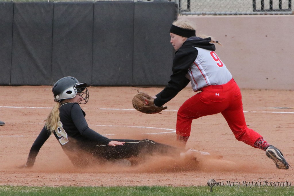 Mariah Encinias slides safe to second as Ashlon Snipes reaches in for the tag.