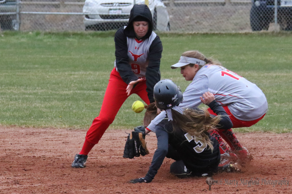 Alexia Romero slides safe into second as Paige Moralez and Ashlon Snipes(9) go for the loose ball