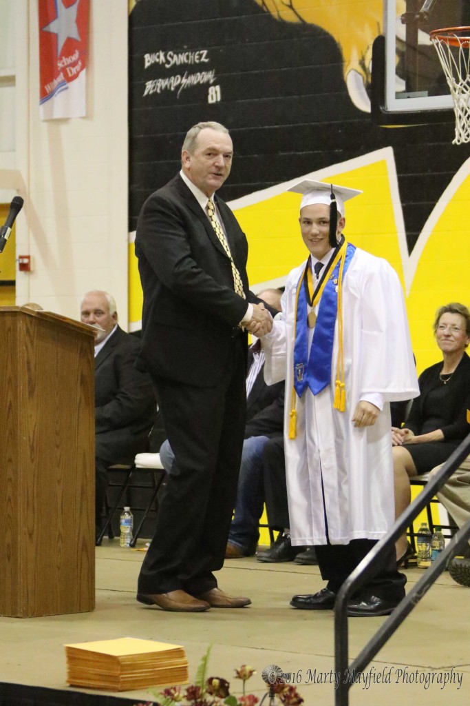 Kyler Daniel receives the Valedictorian honor from Dr Neil Terhune