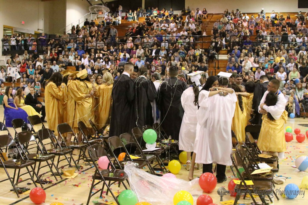 Hugs and congrats all around as the Class of 2016 celebrates their graduation from Raton Public Schools