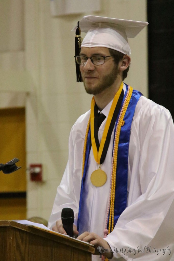 Forrest McConnell takes a moment as he gives the farewell address to his fellow class mates at the Raton High graduation ceremony held Friday evening in Tiger Gym