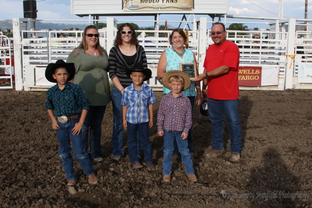 The Raton Rodeo Association honored Leonard "Big Daddy" Lopez for all the support he gave to the rodeo in years past. Monty Colangelo presented the family with a plaque of their appreciation. L to R back Jamie Hephner, Ashley Long, Penny Lopez, Monty Colangelo, front row Colten Lopez, Tyson Lopez and Cooper King. 